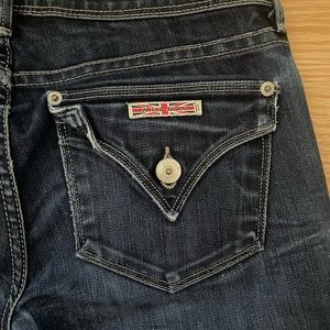 Slight wear on the ankle, back pockets are accessible, long in length